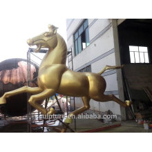large outdoor gold horse sculpture/statue made of red copper
